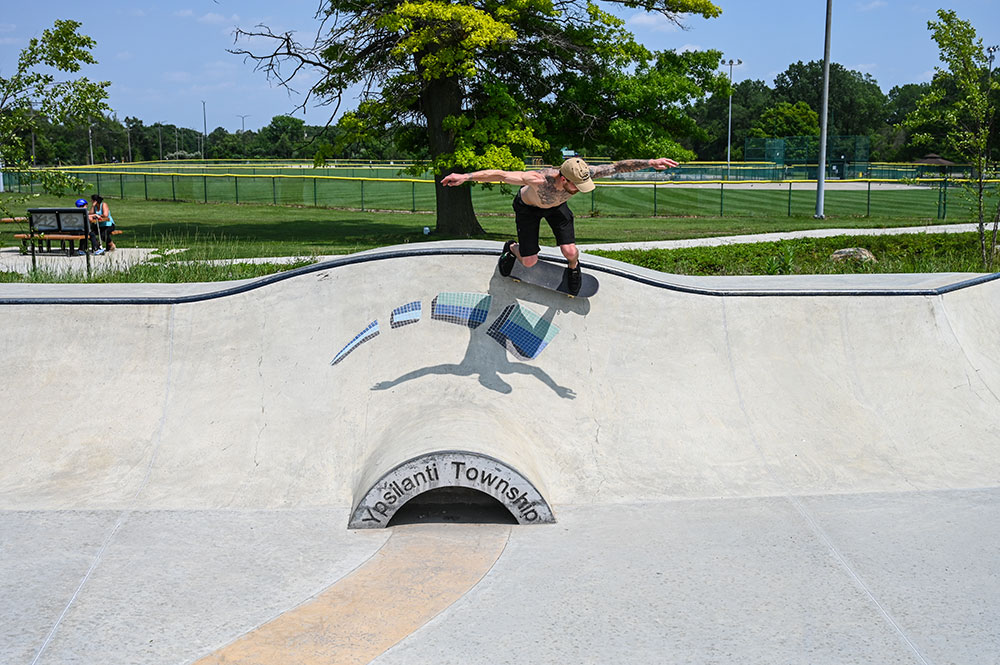 man riding skateboard in skate park