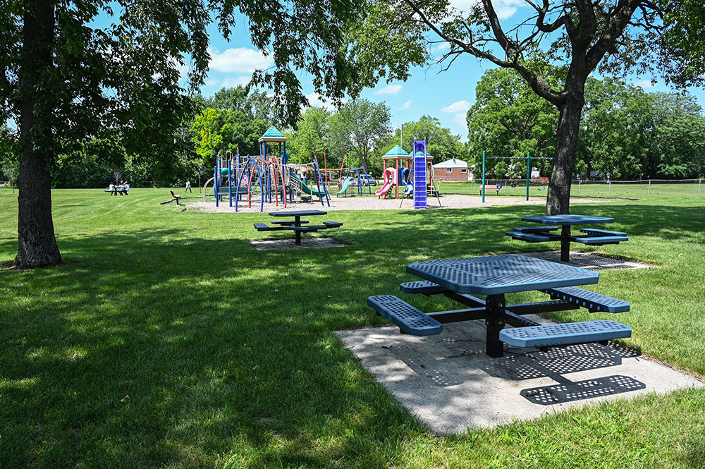 Lakeview Park picnic table with playground in distance