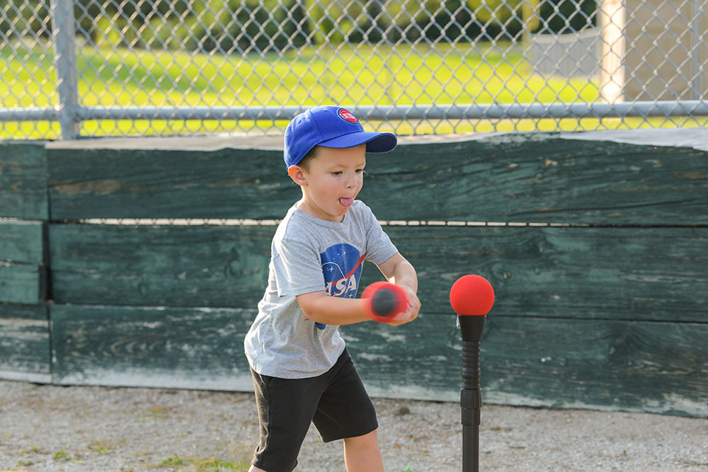 Boy at bat playing t-ball