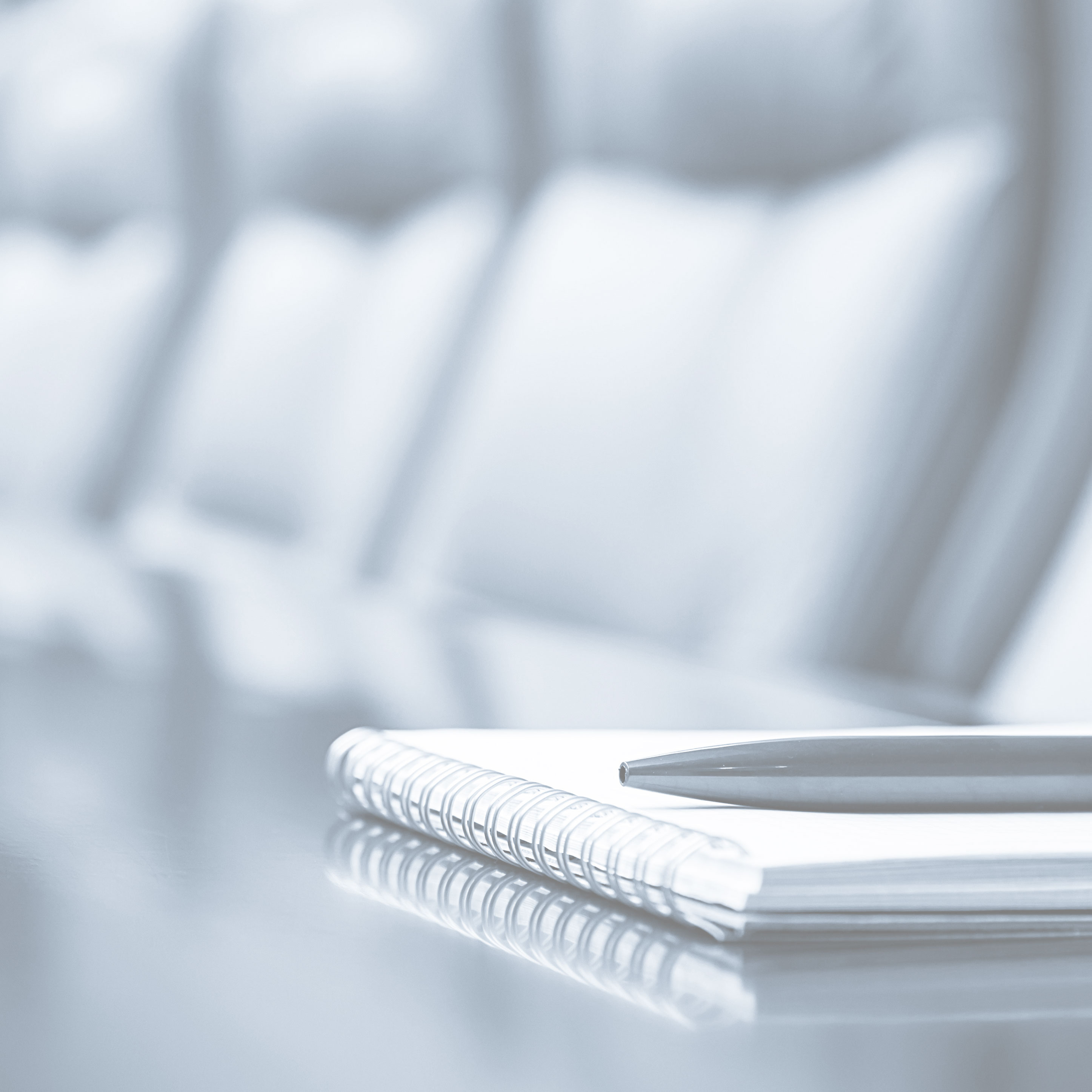 Notepad and pen on a desk